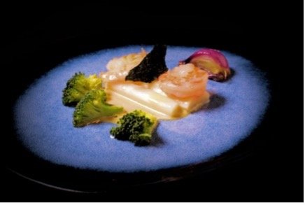 Voorbeeld van Scampi met kokos, serehsaus, broccoli en rode ui